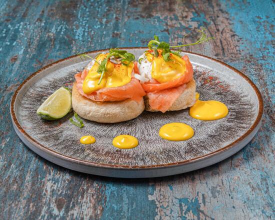 Eggs Royal — poached eggs and smoked salmon on toasted muffin with hollandaise sauce