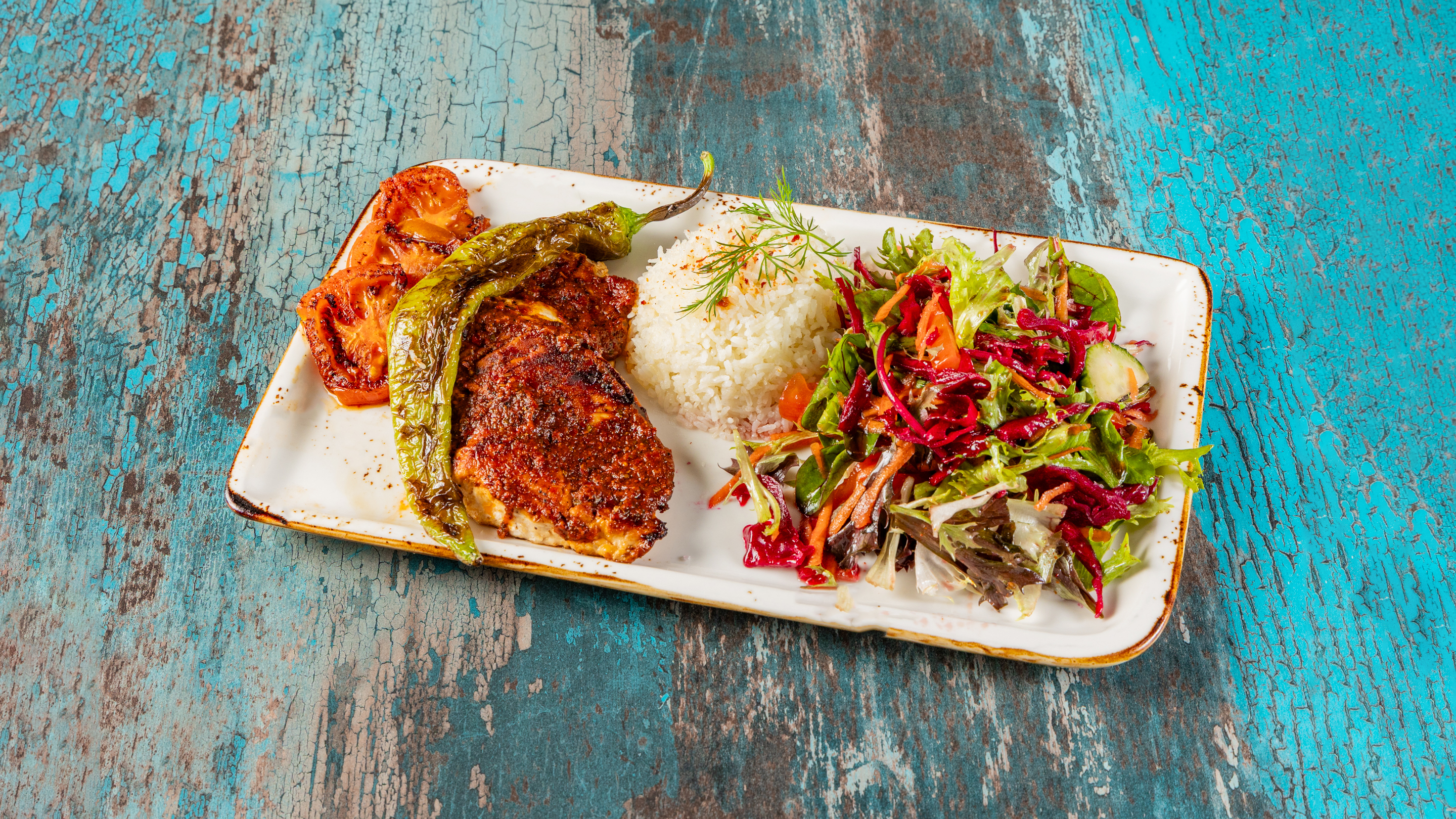 Grilled chicken with Turkish rice, grilled pepper and salad