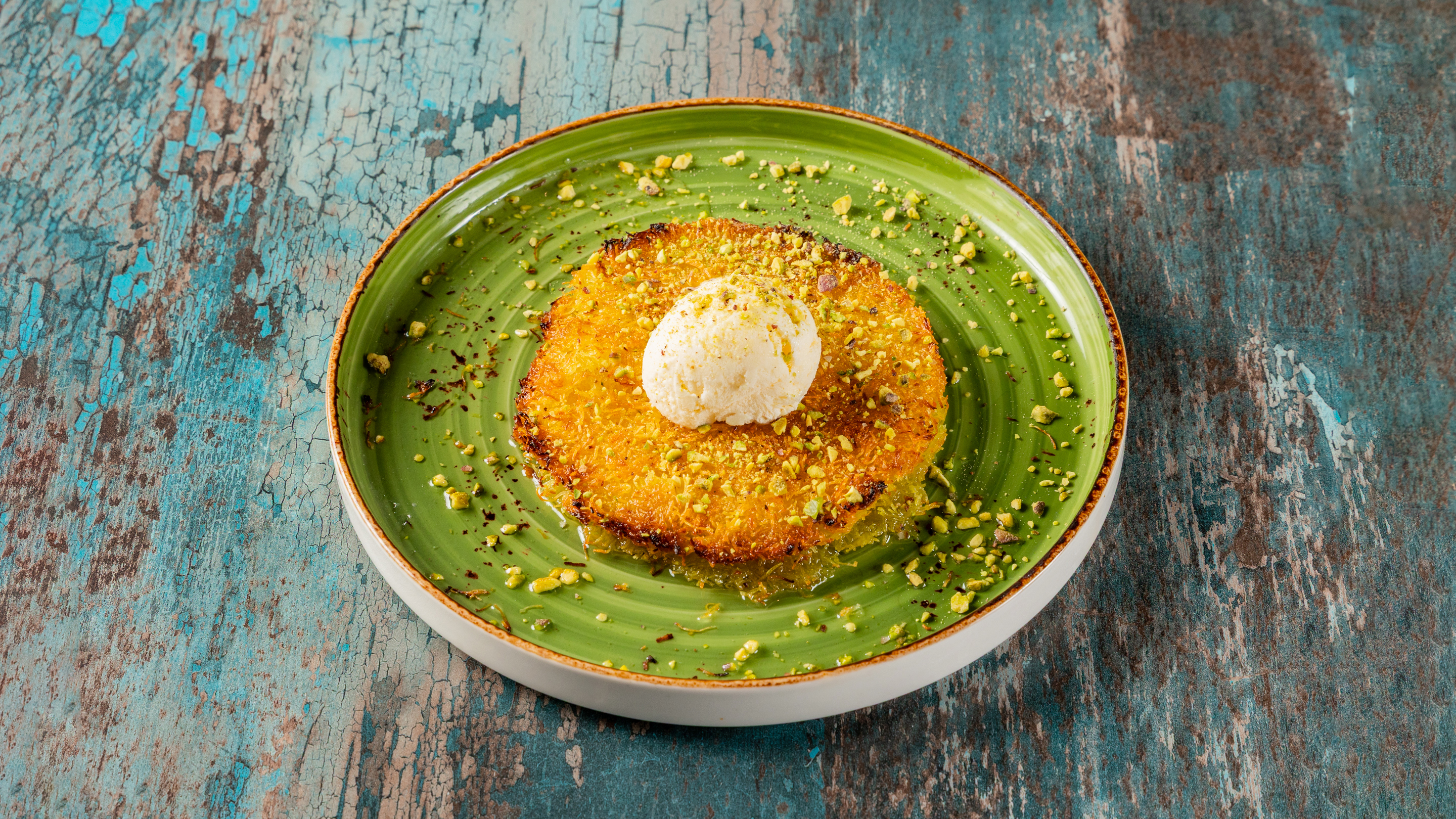 Künefe — crispy shredded wheat dessert with cheese and pistachio syrup